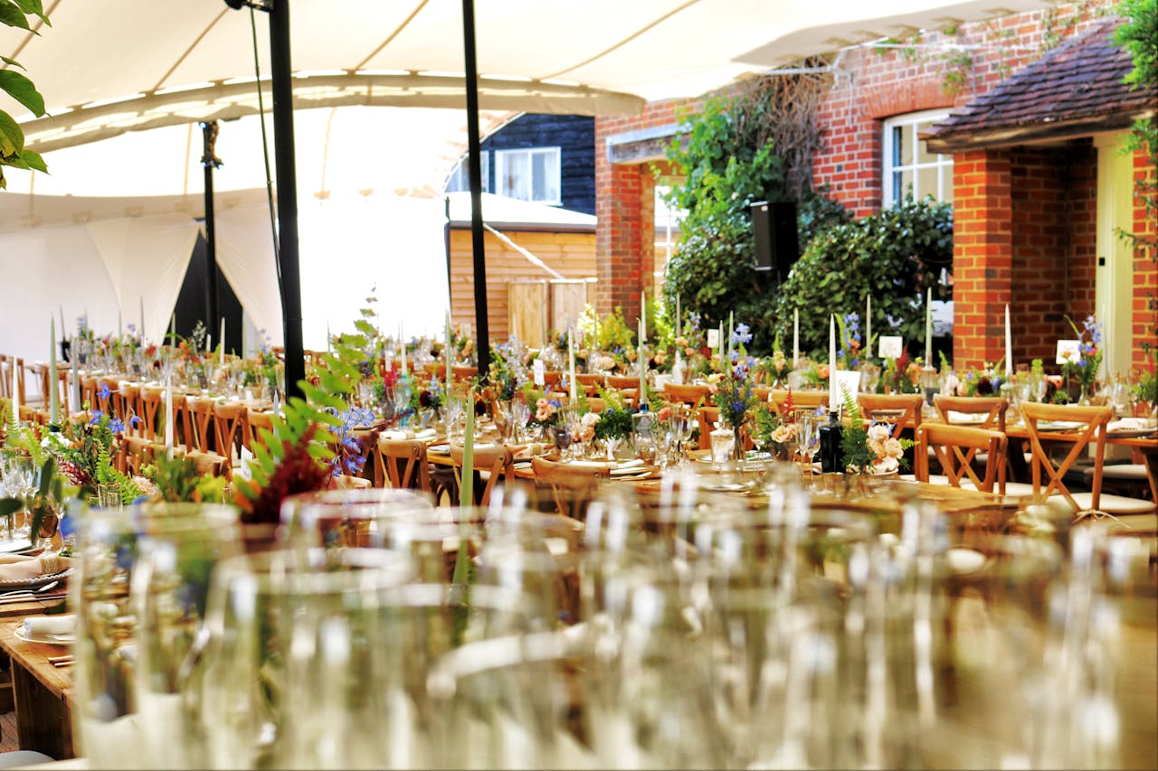 heros-img Charming outdoor dining setting with flowers and fine tableware creating an inviting atmosphere.